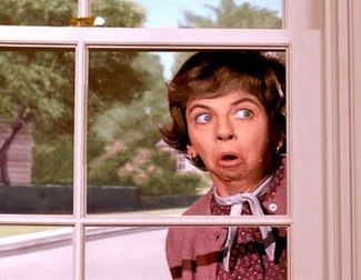 Mrs. Kavitz peaking in through the window pane.